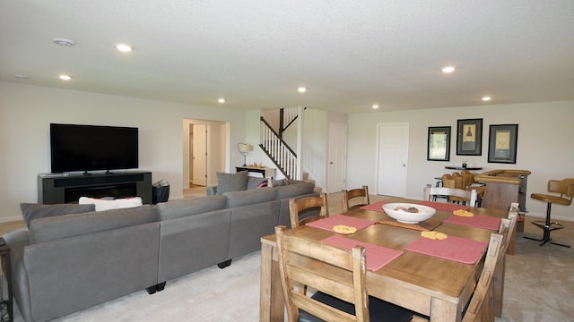1872 Oakpointe Dr, Waconia, MN 55387 - dining area with stairway, light colored carpet, and recessed lighting