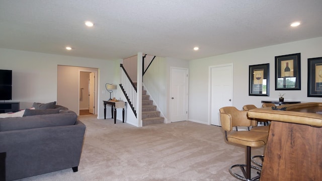 1872 Oakpointe Dr, Waconia, MN 55387 - living area featuring stairs, light colored carpet, and recessed lighting