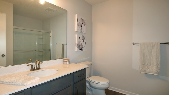 1872 Oakpointe Dr, Waconia, MN 55387 - bathroom featuring vanity, an enclosed shower, and wood finished floors