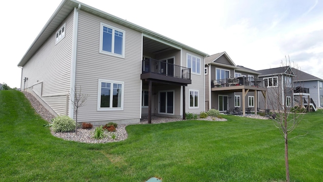 1872 Oakpointe Dr, Waconia, MN 55387 - back of property with a lawn and a balcony