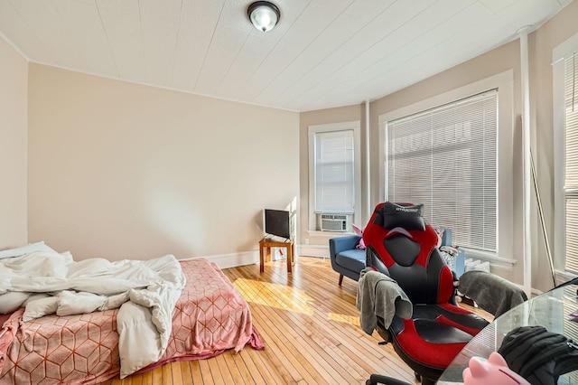 3148 Pleasant Ave, Minneapolis, MN 55408 - bedroom with hardwood / wood-style flooring and cooling unit