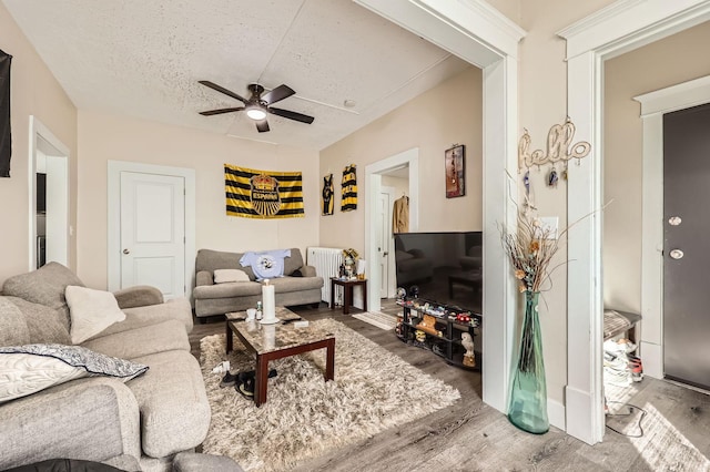 3148 Pleasant Ave, Minneapolis, MN 55408 - living room featuring wood finished floors, ceiling fan, and a textured ceiling
