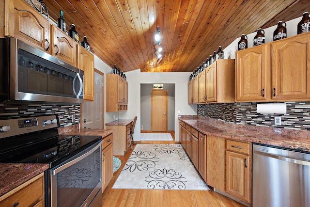20604 Jasmine Path, Lakeville, MN 55044 - kitchen with appliances with stainless steel finishes, tasteful backsplash, vaulted ceiling, light wood-style floors, and dark stone countertops