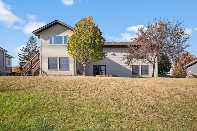 20604 Jasmine Path, Lakeville, MN 55044 - back of property featuring a lawn and stairway