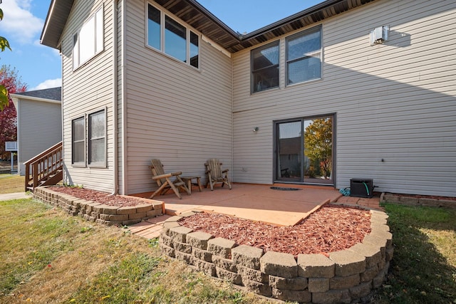 20604 Jasmine Path, Lakeville, MN 55044 - rear view of property with a patio and a lawn