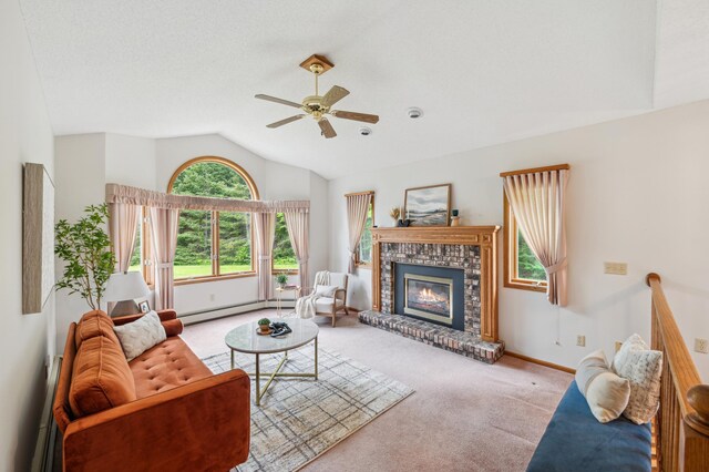 5948 Lavaque Rd, Fredenberg Twp, MN 55803 - living area featuring carpet, ceiling fan, baseboard heating, vaulted ceiling, and a fireplace