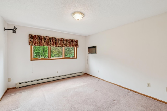 5948 Lavaque Rd, Fredenberg Twp, MN 55803 - spare room featuring a baseboard radiator, carpet floors, and a wall mounted AC