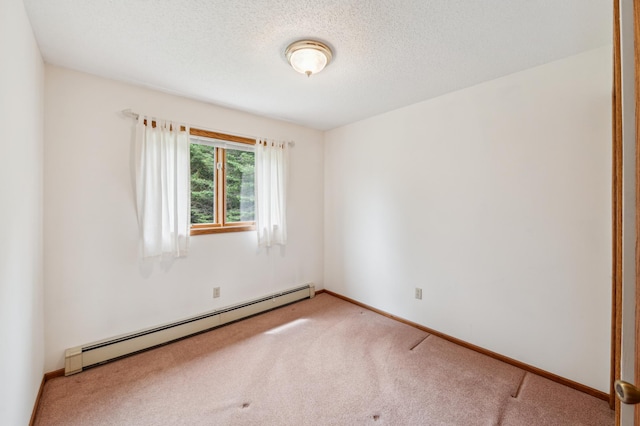 5948 Lavaque Rd, Fredenberg Twp, MN 55803 - carpeted empty room with a baseboard heating unit and a textured ceiling