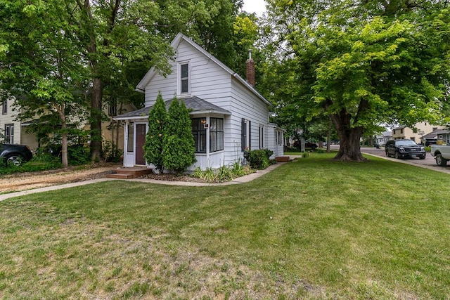 500 Sherman St, North Mankato, MN 56003 - view of front facade with a front lawn and a chimney