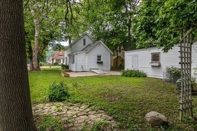 500 Sherman St, North Mankato, MN 56003 - view of green lawn featuring a patio area