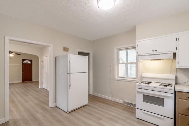 500 Sherman St, North Mankato, MN 56003 - kitchen with white appliances, ventilation hood, light wood finished floors, light countertops, and a textured ceiling