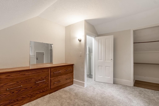 500 Sherman St, North Mankato, MN 56003 - bedroom featuring lofted ceiling, carpet flooring, a textured ceiling, and a closet