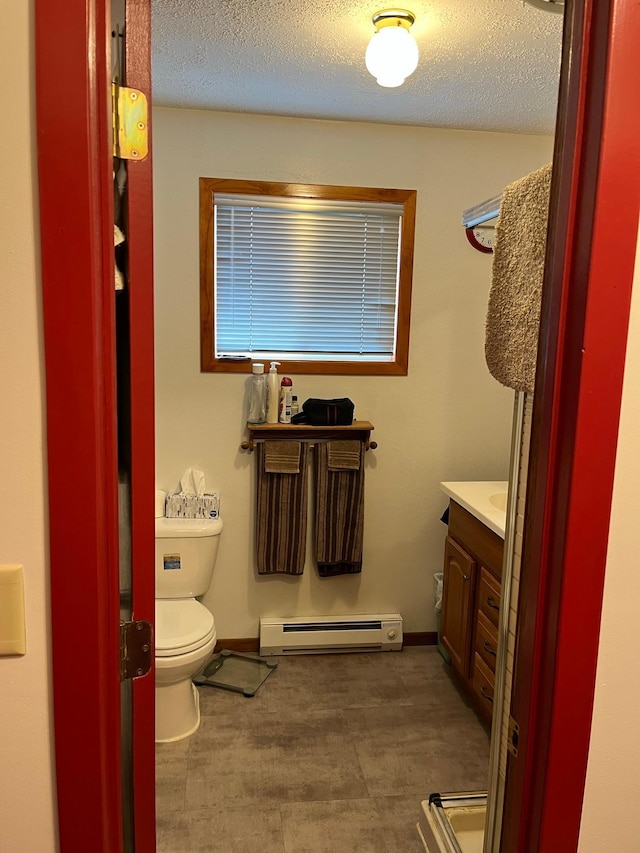 44250 Posterity Beach Ln, Waubun, MN 56589 - bathroom featuring baseboard heating, vanity, and a textured ceiling