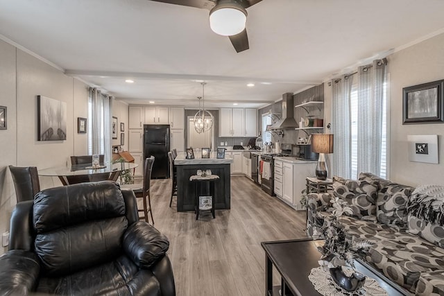 616 Southhaven Dr, Mankato, MN 56001 - living room featuring light wood-style floors, a chandelier, crown molding, a ceiling fan, and recessed lighting