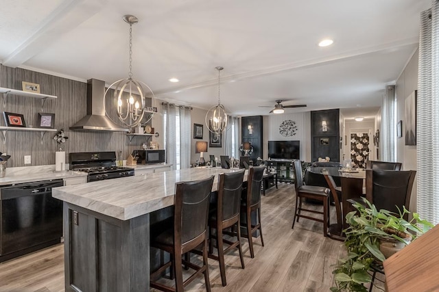 616 Southhaven Dr, Mankato, MN 56001 - kitchen featuring wall chimney exhaust hood, black appliances, open shelves, a chandelier, and light countertops