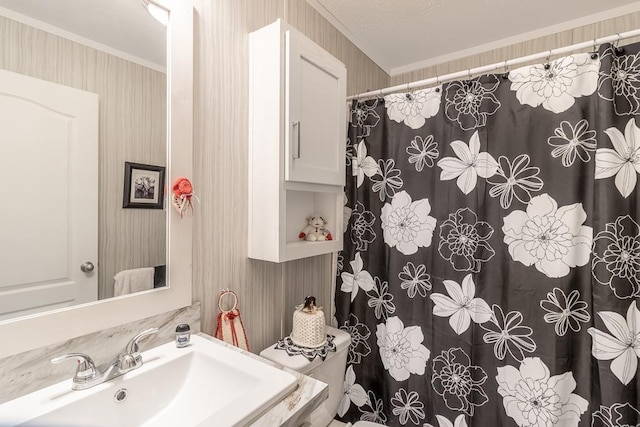 616 Southhaven Dr, Mankato, MN 56001 - full bathroom with crown molding, wallpapered walls, and curtained shower