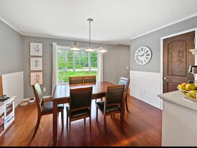 315 32nd St, Grand Rapids, MN 55744 - dining area featuring ornamental molding and dark wood-style floors