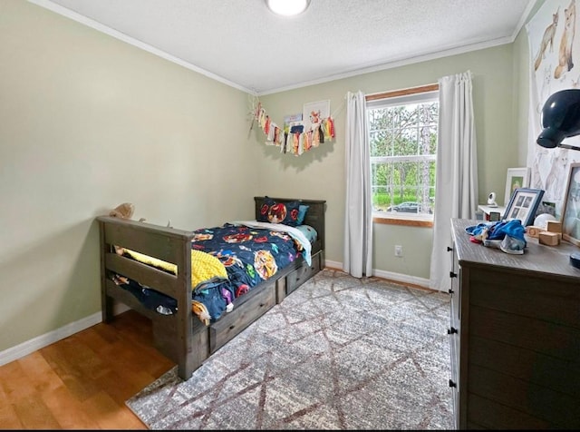 315 32nd St, Grand Rapids, MN 55744 - bedroom with ornamental molding and wood finished floors