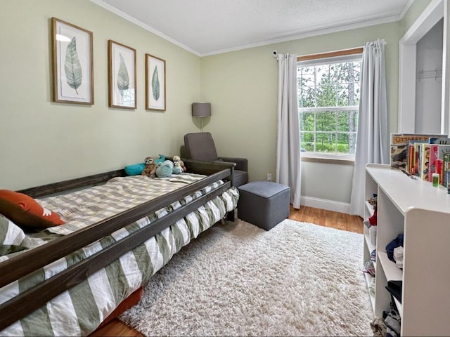 315 32nd St, Grand Rapids, MN 55744 - bedroom featuring wood finished floors and ornamental molding