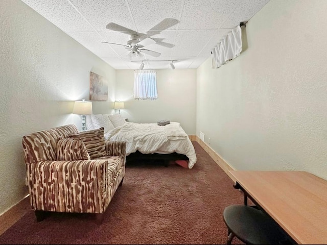 315 32nd St, Grand Rapids, MN 55744 - bedroom featuring a drop ceiling, carpet, a textured wall, and a ceiling fan