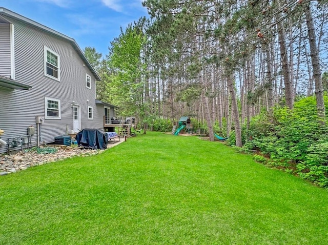 315 32nd St, Grand Rapids, MN 55744 - view of grassy yard with a playground
