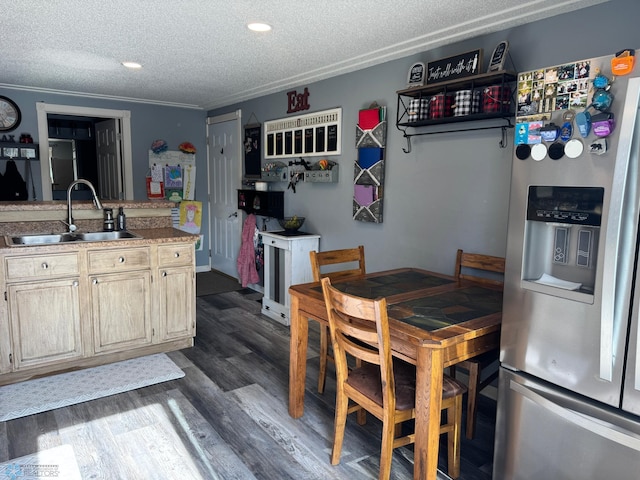 418 4th Ave W, Lisbon, ND 58054 - kitchen with stainless steel fridge with ice dispenser, a textured ceiling, dark wood-style floors, recessed lighting, and crown molding