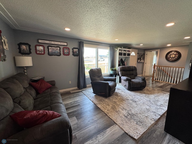 418 4th Ave W, Lisbon, ND 58054 - living room featuring a textured ceiling, wood finished floors, and recessed lighting