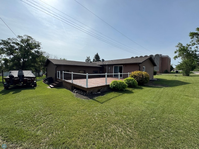 418 4th Ave W, Lisbon, ND 58054 - back of house with a yard and a wooden deck
