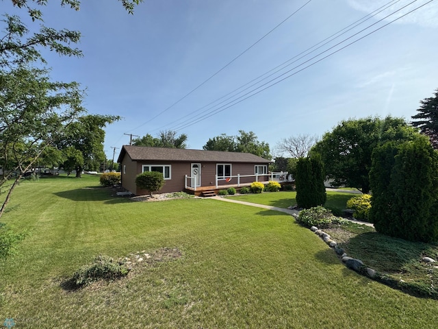 418 4th Ave W, Lisbon, ND 58054 - view of green lawn with a deck