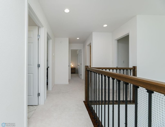 7328 Aquiline Dr S, Fargo, ND 58104 - corridor featuring light carpet, recessed lighting, and an upstairs landing