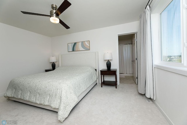 7328 Aquiline Dr S, Fargo, ND 58104 - bedroom with light colored carpet and a ceiling fan