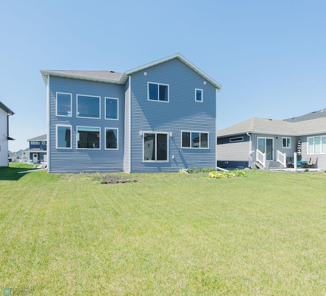 7328 Aquiline Dr S, Fargo, ND 58104 - back of house with a yard