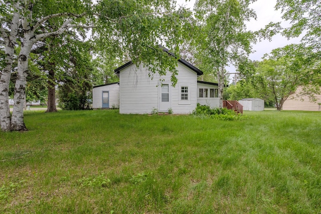 196 Beaulieu St W, Motley, MN 56466 - view of green lawn featuring a storage unit