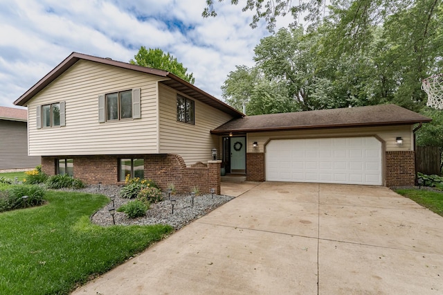 5520 25th Ave NW, Rochester, MN 55901 - split level home with driveway, a garage, brick siding, and a front yard