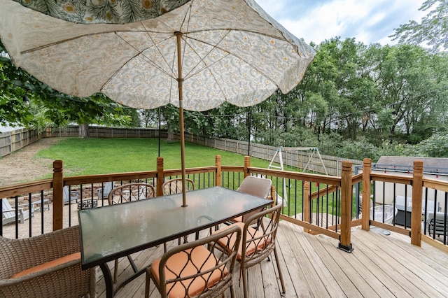 5520 25th Ave NW, Rochester, MN 55901 - wooden terrace with a fenced backyard, outdoor dining area, and view of scattered trees