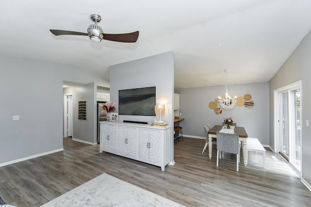 5520 25th Ave NW, Rochester, MN 55901 - living area with wood finished floors, a chandelier, lofted ceiling, and ceiling fan