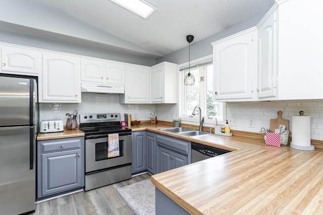 5520 25th Ave NW, Rochester, MN 55901 - kitchen featuring stainless steel appliances, under cabinet range hood, vaulted ceiling, white cabinets, and pendant lighting