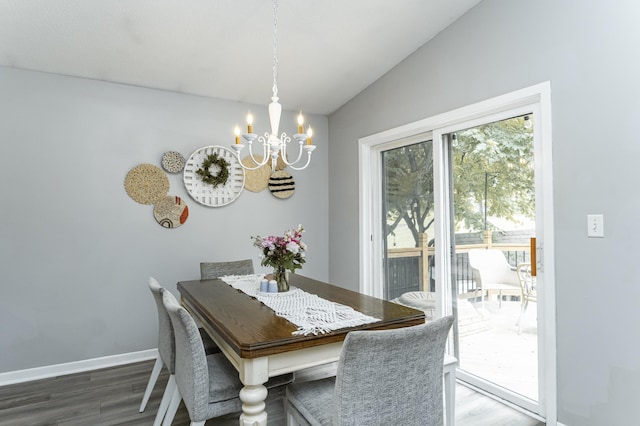 5520 25th Ave NW, Rochester, MN 55901 - dining space with a chandelier, wood finished floors, and vaulted ceiling