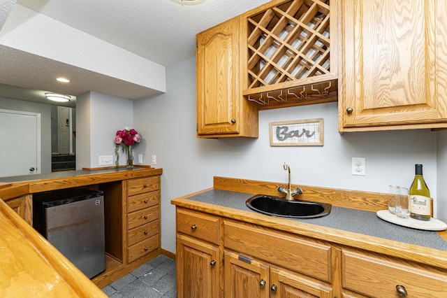 5520 25th Ave NW, Rochester, MN 55901 - kitchen featuring butcher block countertops, refrigerator, recessed lighting, and a textured ceiling