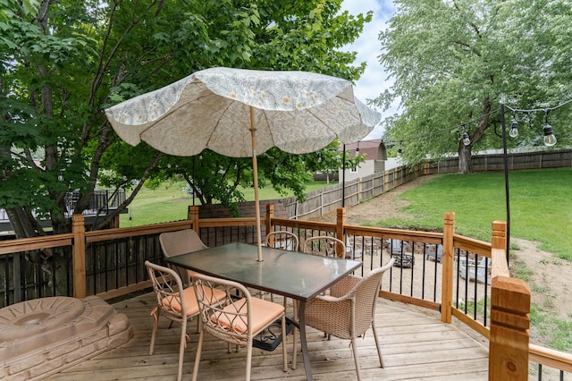 5520 25th Ave NW, Rochester, MN 55901 - wooden deck featuring outdoor dining area and a fenced backyard