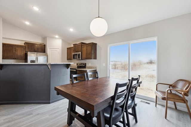 945 Breckenridge Ln, Montrose, MN 55363 - dining space with light wood-type flooring, lofted ceiling, and recessed lighting