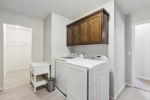 945 Breckenridge Ln, Montrose, MN 55363 - washroom featuring cabinet space, light wood-style flooring, and independent washer and dryer