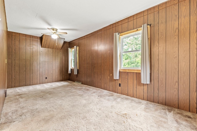W3767 750th Ave, Gilman Twp, WI 54767 - carpeted empty room with a ceiling fan and wooden walls
