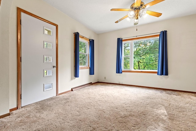 W3767 750th Ave, Gilman Twp, WI 54767 - carpeted empty room featuring a ceiling fan and a baseboard heating unit
