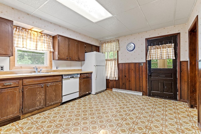W3767 750th Ave, Gilman Twp, WI 54767 - kitchen featuring white appliances, plenty of natural light, wood walls, light countertops, and a drop ceiling