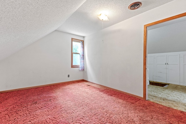 W3767 750th Ave, Gilman Twp, WI 54767 - additional living space with carpet flooring, a textured ceiling, and lofted ceiling