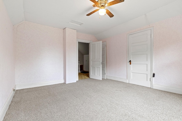 W3767 750th Ave, Gilman Twp, WI 54767 - unfurnished bedroom with vaulted ceiling, light colored carpet, and a ceiling fan