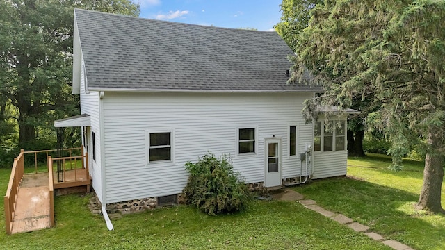 W3767 750th Ave, Gilman Twp, WI 54767 - rear view of property featuring a shingled roof and a yard