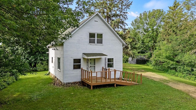 W3767 750th Ave, Gilman Twp, WI 54767 - back of house featuring a deck and a lawn
