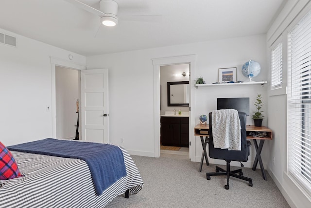 7568 Glen Alcove, Woodbury, MN 55129 - carpeted bedroom with ensuite bathroom, ceiling fan, and a desk